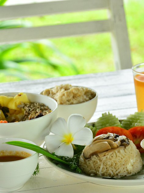 A vegetarian set lunch garnished with frangipani